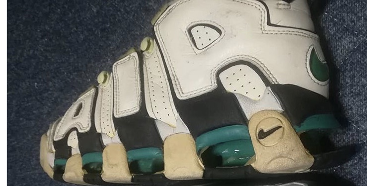 The Nike Air More Uptempo in the white, black, deep emerald colorway. 