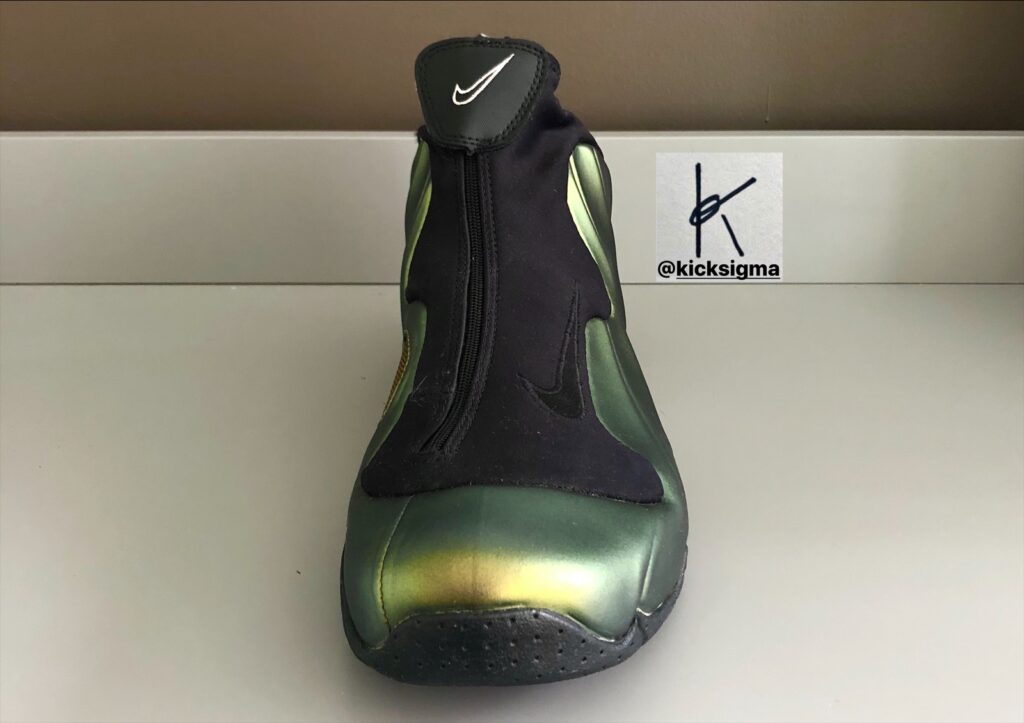 The Nike Flightposite 1, metallic gold, left shoe front view. 