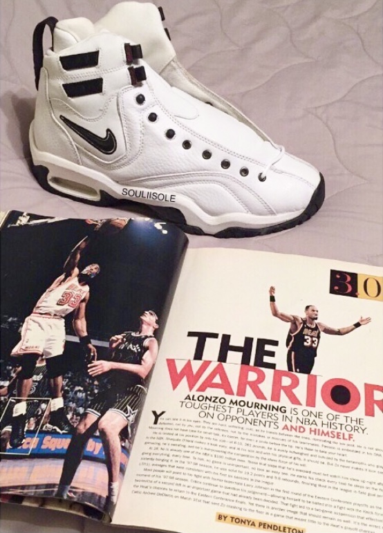 The Nike Air Alonzo in the white/black colorway and SLAM magazine. 
