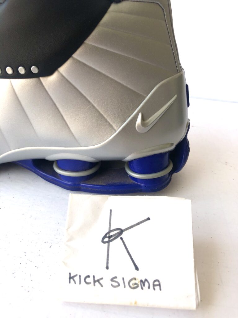 The Nike Shox BB4, black, silver, lapis colorway, Shox columns. 