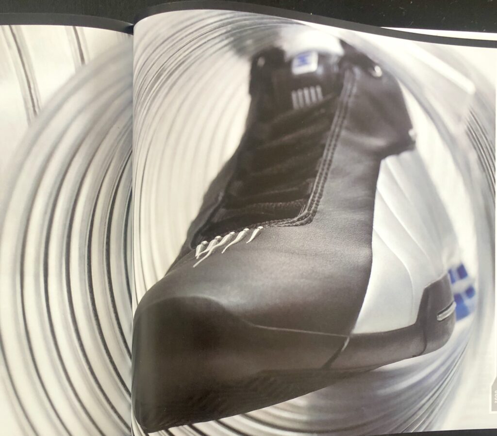 The Nike Shox BB4, black, silver, lapis colorway. 