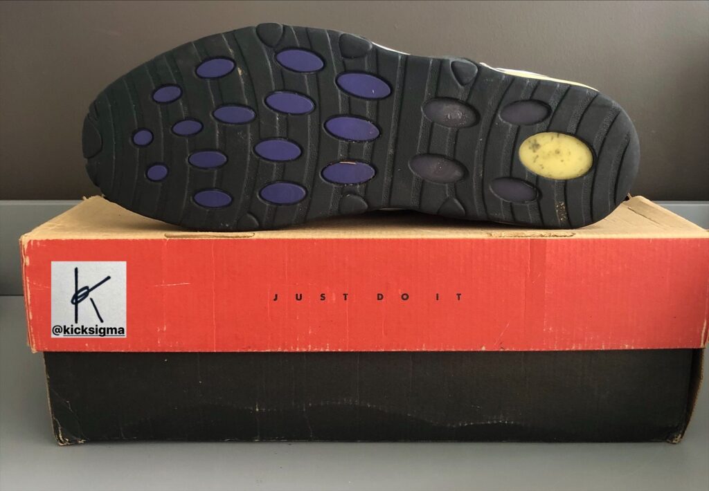 The Nike Air Max Uptempo, black, white, dark concord, left shoe bottom view. 