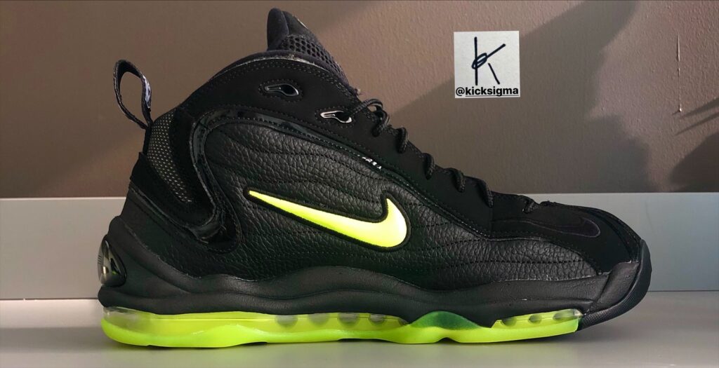 The Nike Air Total Max Uptempo, black, volt colorway, medial view. 