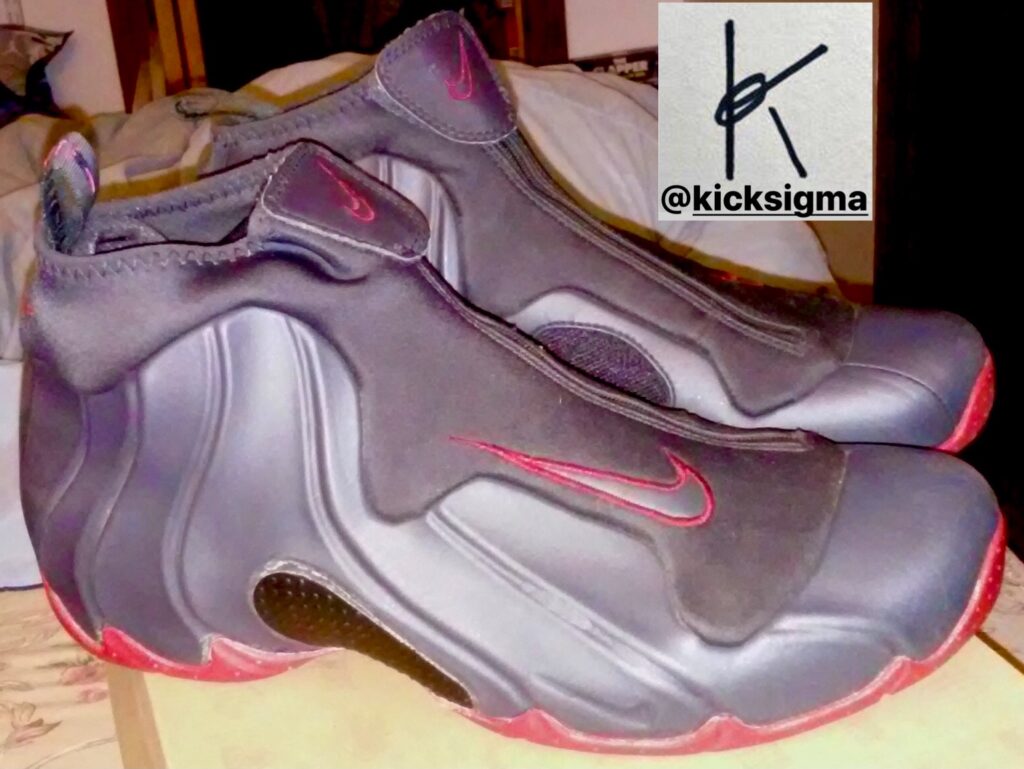 The Nike Flightposite, charcoal, red colorway, lateral view. 